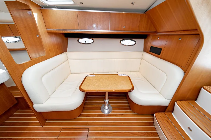 Slide: The Image of 2005 Tiara Yachts 3600 Open interior with wood flooring and seating area. - 46