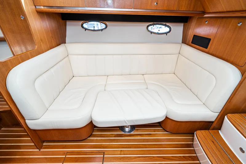 Slide: The Image of 2005 Tiara Yachts 3600 Open interior with white leather seating. - 47