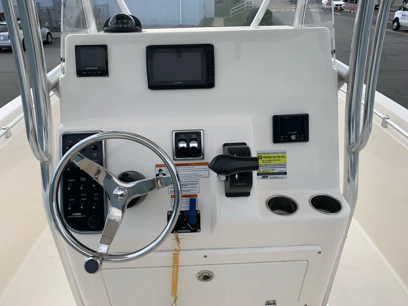 Slide: The Image of Cobia 237 Center Console 2020 helm with steering wheel and instruments. - 6