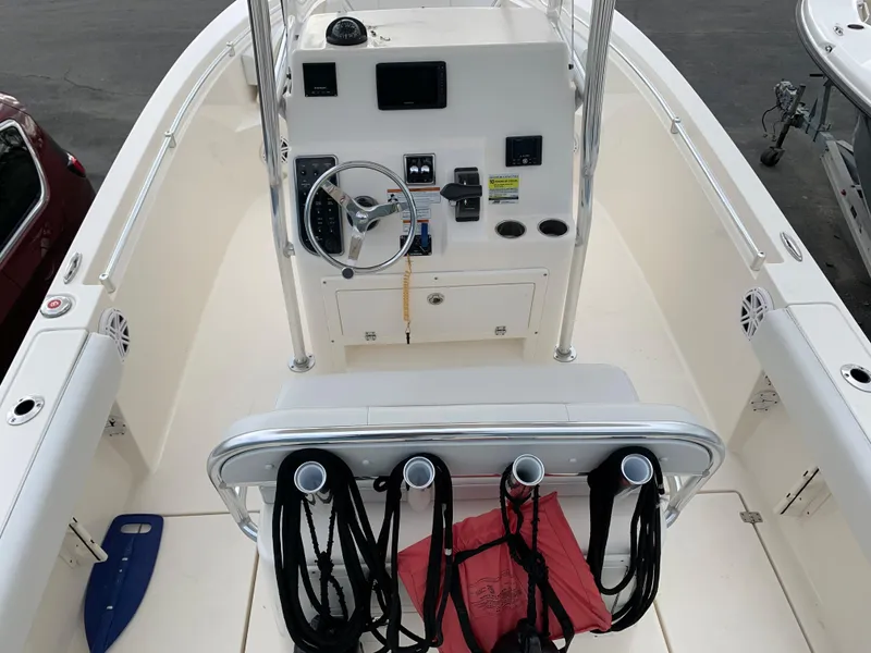 Slide: The Image of 2020 Cobia 237 Center Console, helm with instruments and seating. - 7