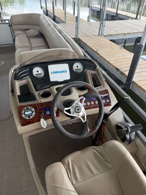 Slide: The Image of Cockpit of a 2017 Regency 254 DL3 pontoon boat. - 2