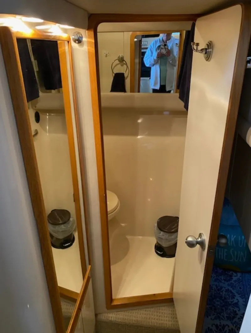 Slide: The Image of Bathroom in 1996 Sea Ray 440 Express Bridge boat. - 23