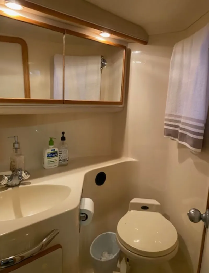 Slide: The Image of Bathroom of 1996 Sea Ray 440 Express Bridge. - 25