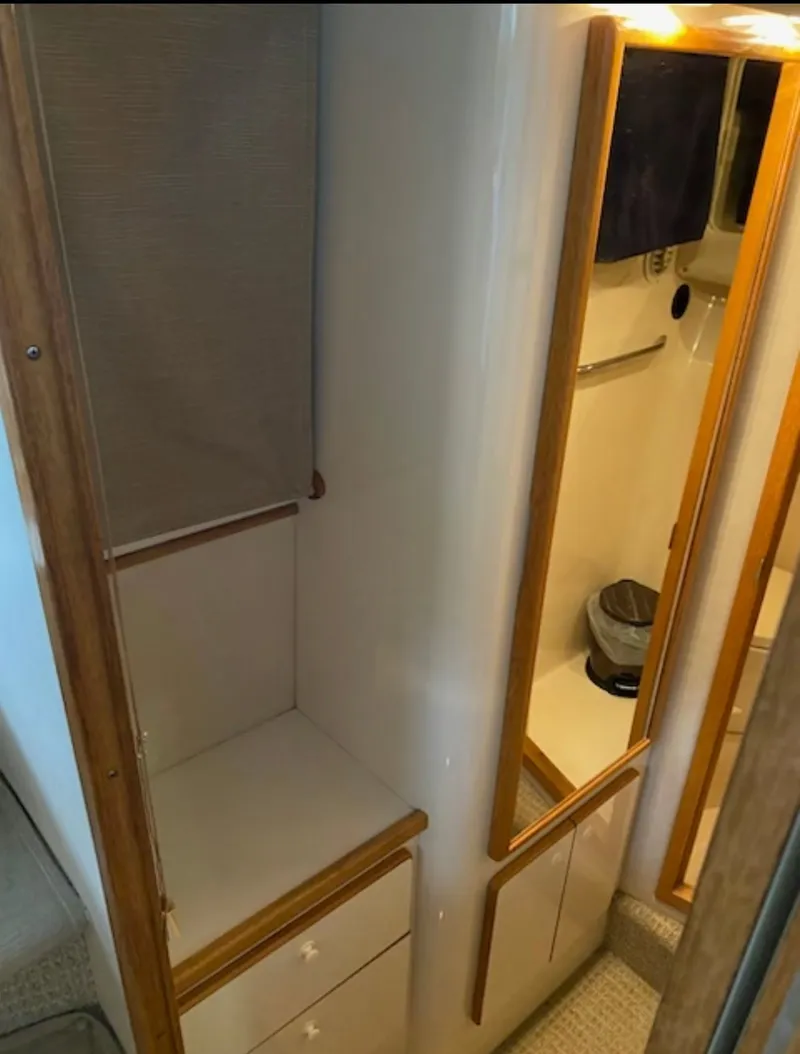 Slide: The Image of Interior of 1996 Sea Ray 440 Express Bridge, bathroom view. - 29