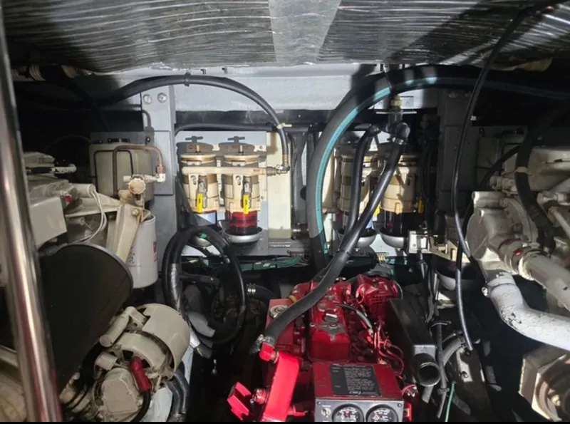 Slide: The Image of 1996 Sea Ray 440 Express Bridge engine room view. - 33