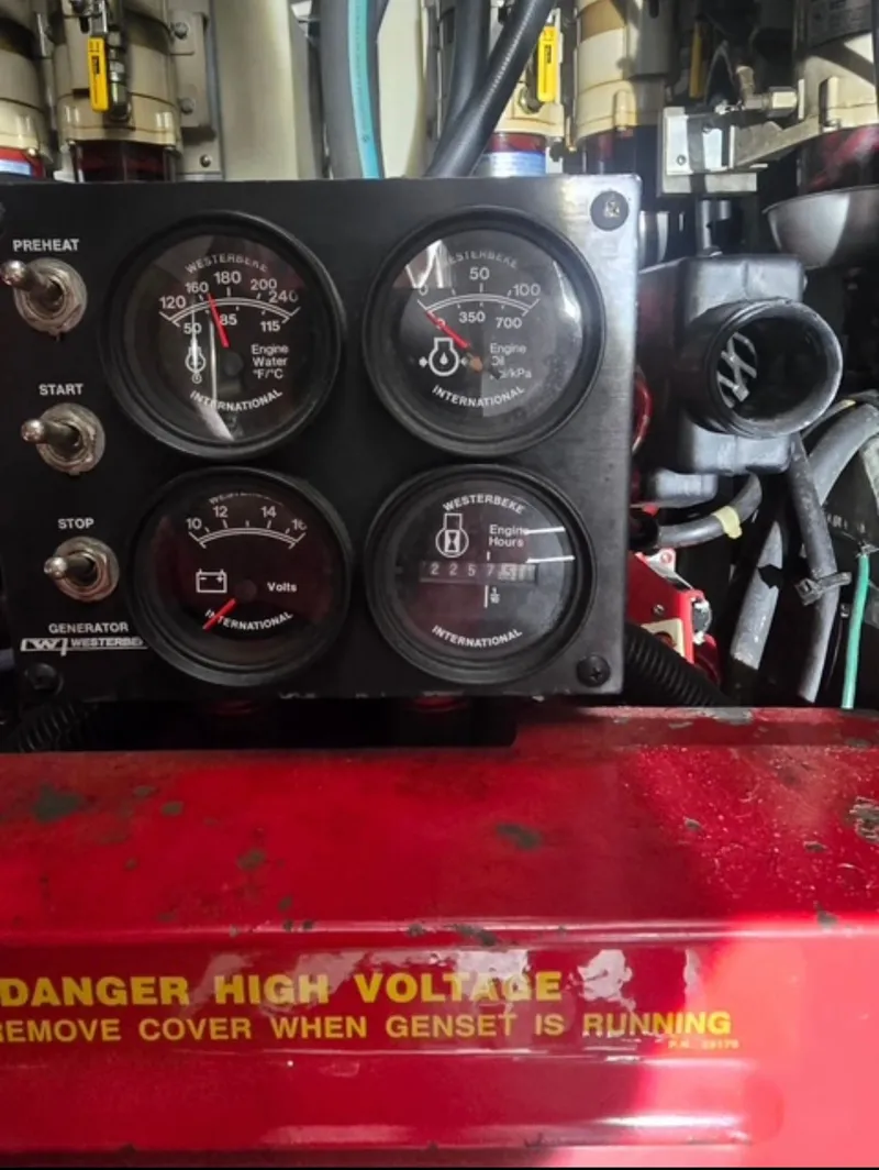 Slide: The Image of Generator control panel on a 1996 Sea Ray 440 Express Bridge boat. - 36