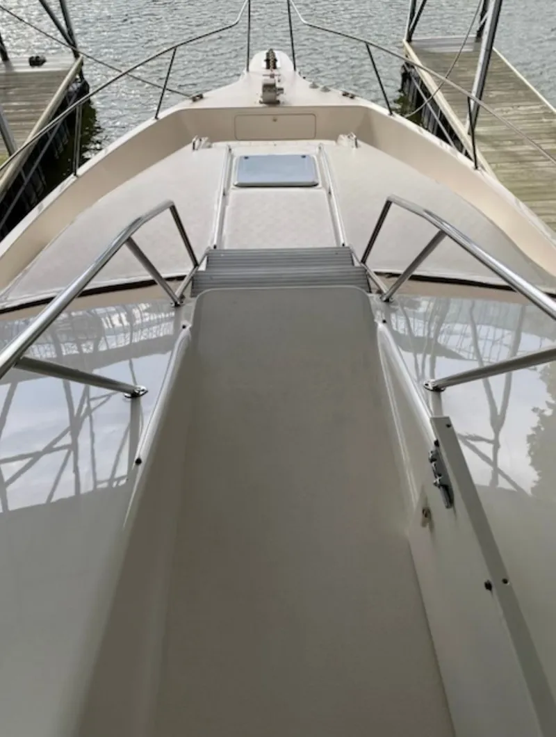 Slide: The Image of Deck view of the 1996 Sea Ray 440 Express Bridge. - 5