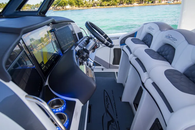 Slide: The Image of Interior of 2023 MTI 50v boat with advanced navigation system and luxury seating. - 11