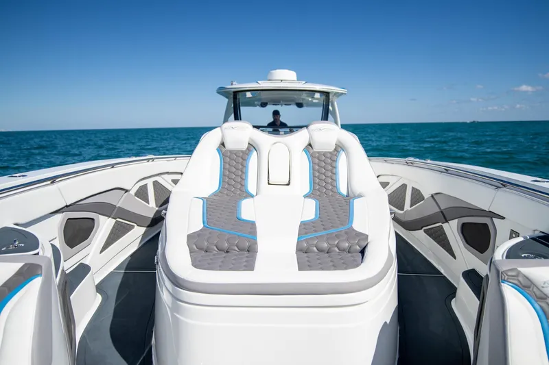 Slide: The Image of Luxury MTI 50v 2023 boat interior with stylish seating on open water. - 15