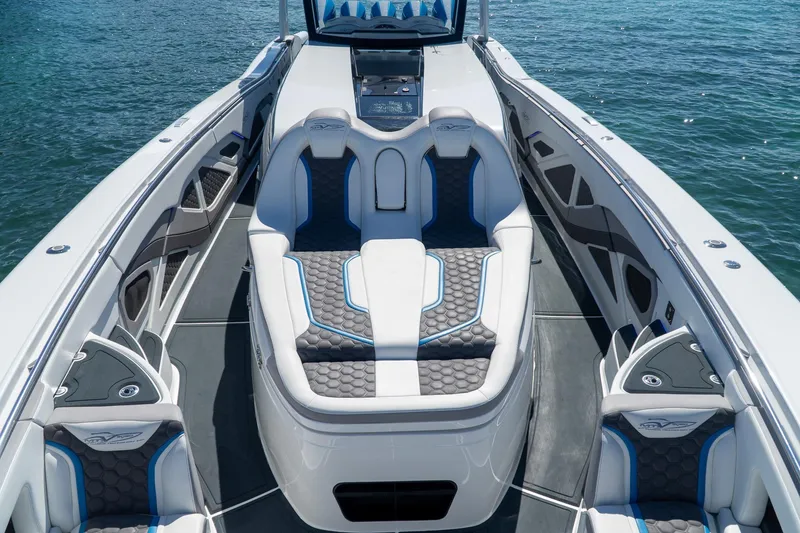 Slide: The Image of Luxurious 2023 MTI 50v boat interior with sleek seating and modern design on the water. - 17