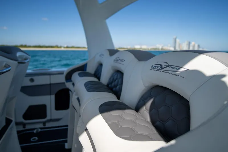 Slide: The Image of Luxury seating on 2023 MTI 50v boat with ocean and city skyline in background. - 18