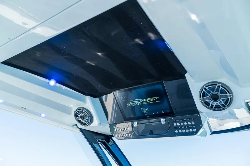 Slide: The Image of 2023 MTI 50v boat interior with advanced control panel and speakers. - 19