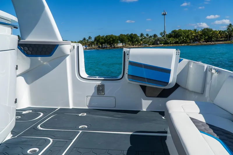 Slide: The Image of Luxurious MTI 50v boat interior, 2023 model, featuring sleek seating and ocean view. - 22