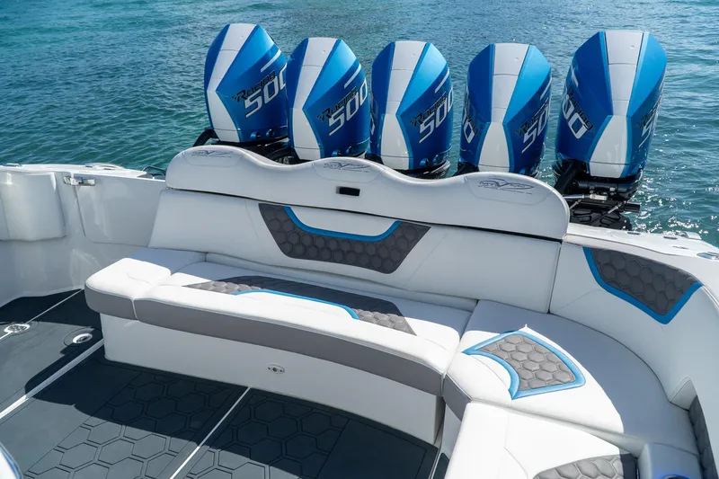 Slide: The Image of Luxury MTI 50v boat with five powerful outboard engines, 2023 model, on clear blue water. - 23