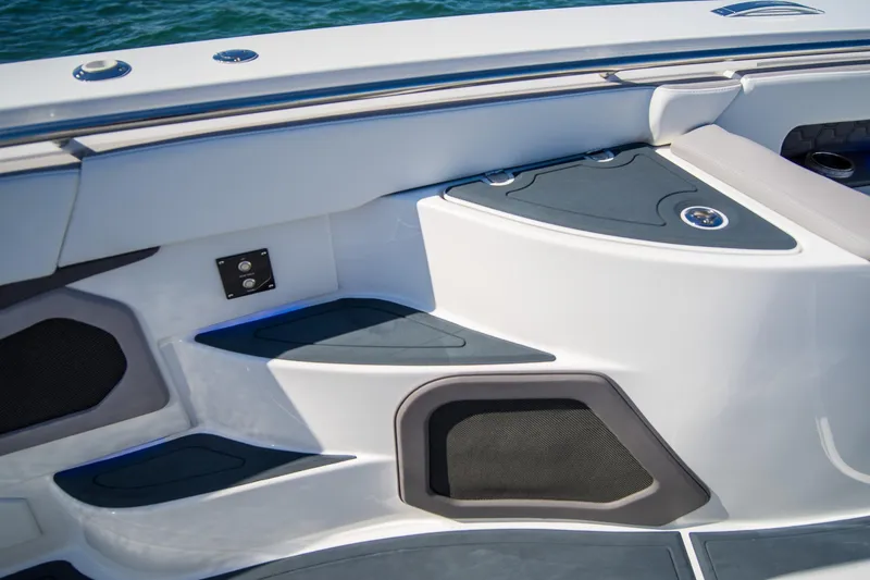 Slide: The Image of Interior view of 2023 MTI 50v boat, featuring sleek seating and modern design elements. - 31