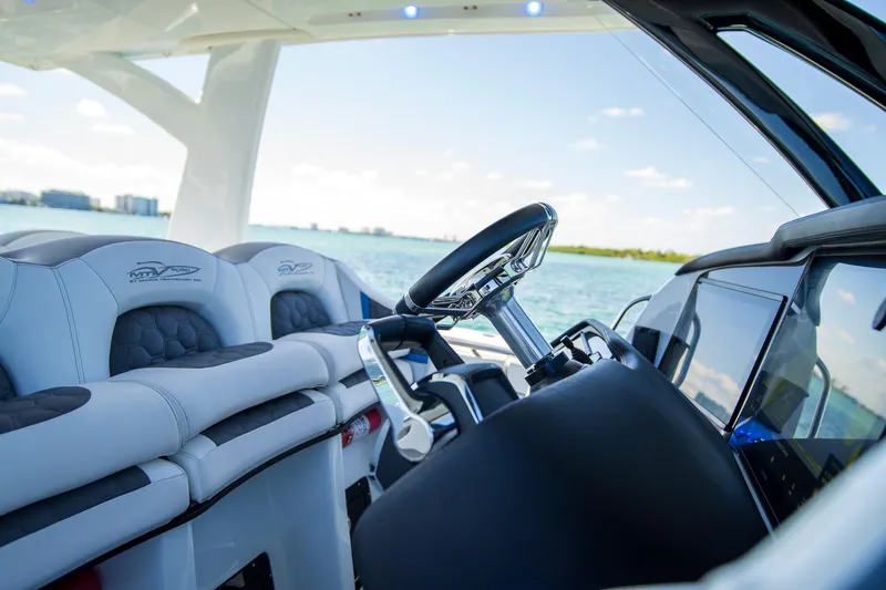 Slide: The Image of Luxury MTI 50v boat interior with modern steering and seating, 2023 model. - 35