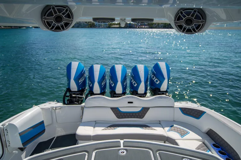 Slide: The Image of Luxury MTI 50v boat with five powerful engines, 2023 model, on sparkling blue water. - 37
