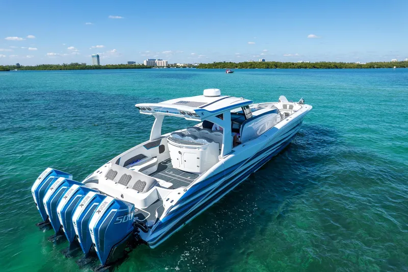 Slide: The Image of Luxury MTI 50v boat cruising on clear blue waters, 2023 model. - 4