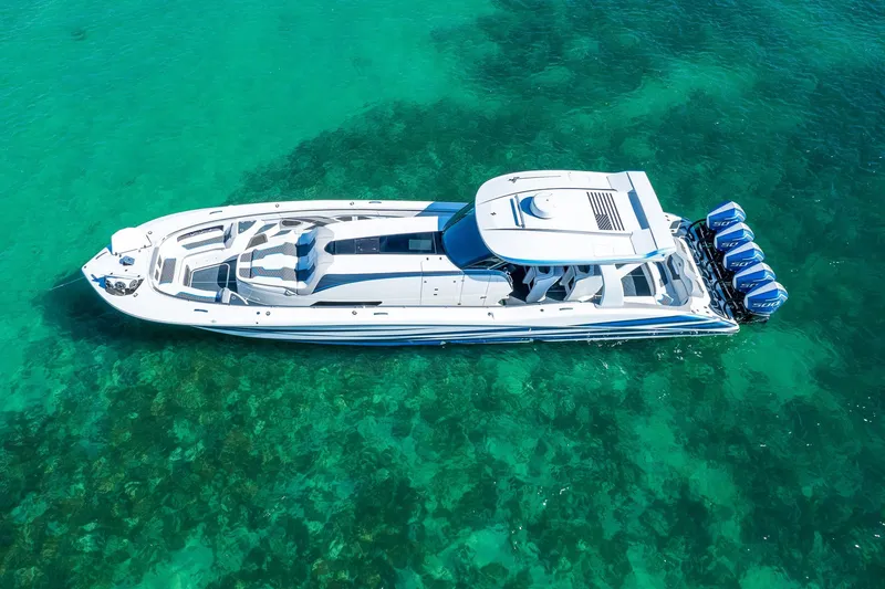 Slide: The Image of Aerial view of 2023 MTI 50v boat on clear turquoise water. - 5