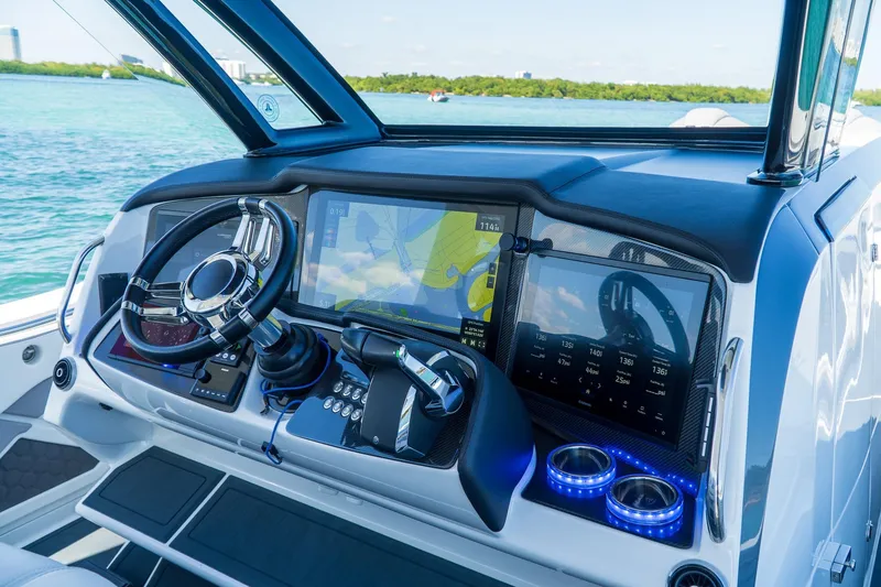Slide: The Image of Dashboard of 2023 MTI 50v boat with navigation screens and steering wheel. - 6