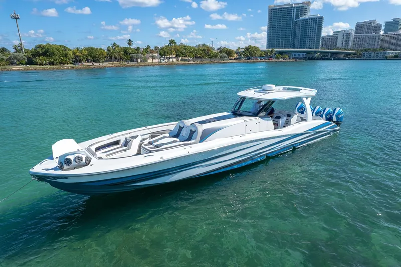 Slide: The Image of Luxury MTI 50v boat cruising in clear blue water, 2023 model. - 60