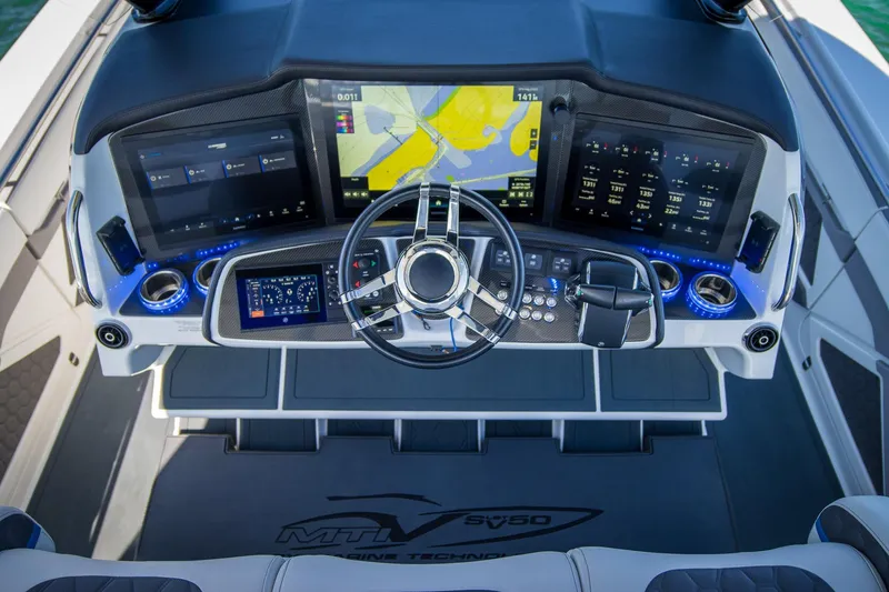Slide: The Image of Modern MTI 50v boat dashboard with advanced navigation screens and controls, 2023 model. - 9