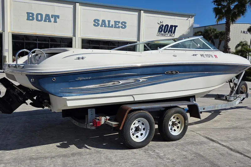 Slide: The Image of 2004 Sea Ray 200 Sport boat on trailer at dealership, ready for sale. - 2