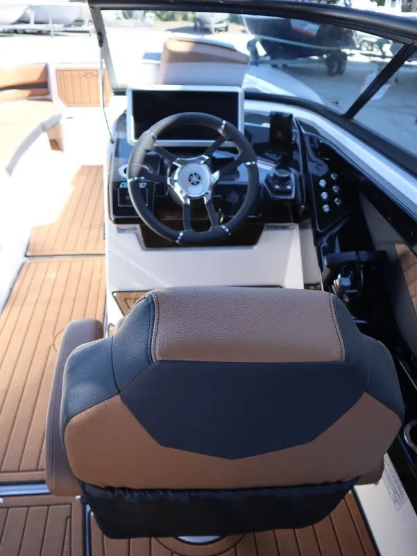 Slide: The Image of Interior view of 2026 Yamaha Boats 252SE cockpit with steering wheel. - 10