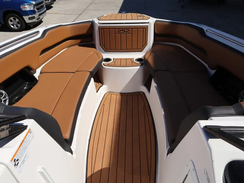 Slide: The Image of Interior of 2026 Yamaha Boats 252SE with brown seating. - 14