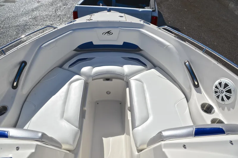 Slide: The Image of 2011 Monterey 234FS boat interior with white seating and speaker system. - 20