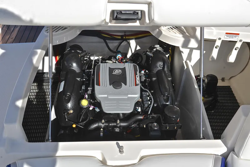 Slide: The Image of 2011 Monterey 234FS boat engine compartment with visible 350 MAG engine. - 29