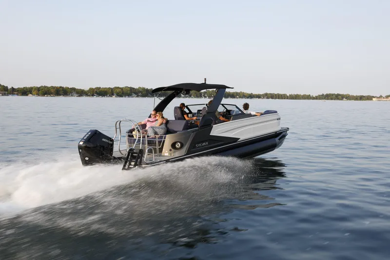 Slide: The Image of 2025 Sylvan M5 CLZ DC boat cruising on a serene lake. - 28