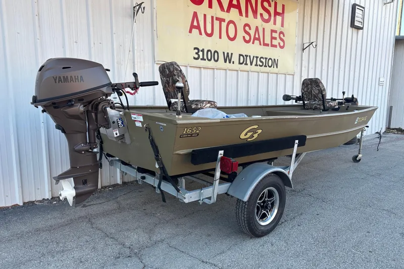 Slide: The Image of 2025 G3 Gator Tough 1652 VBW boat with Yamaha motor on trailer at dealership. - 14