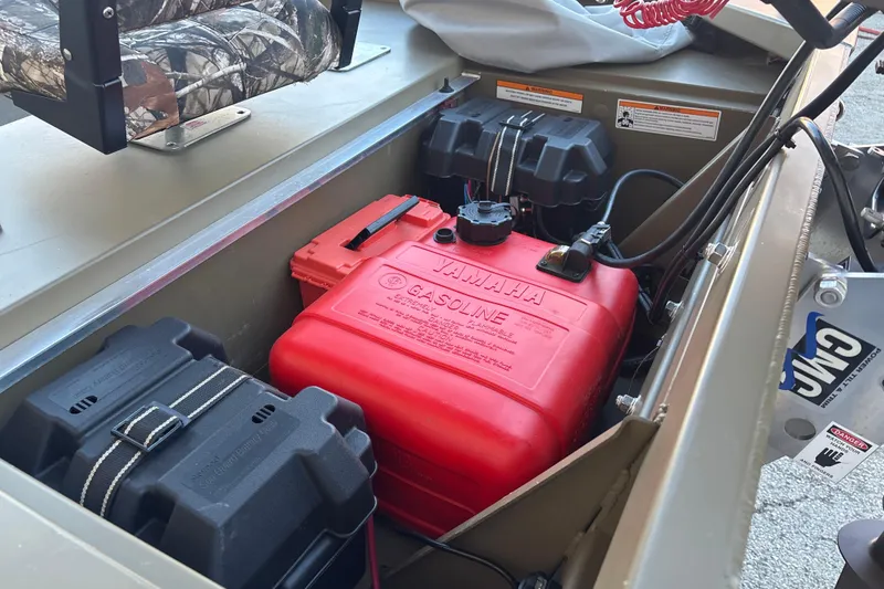 Slide: The Image of 2025 G3 Gator Tough 1652 VBW boat interior with Yamaha gasoline tank and battery compartments. - 17