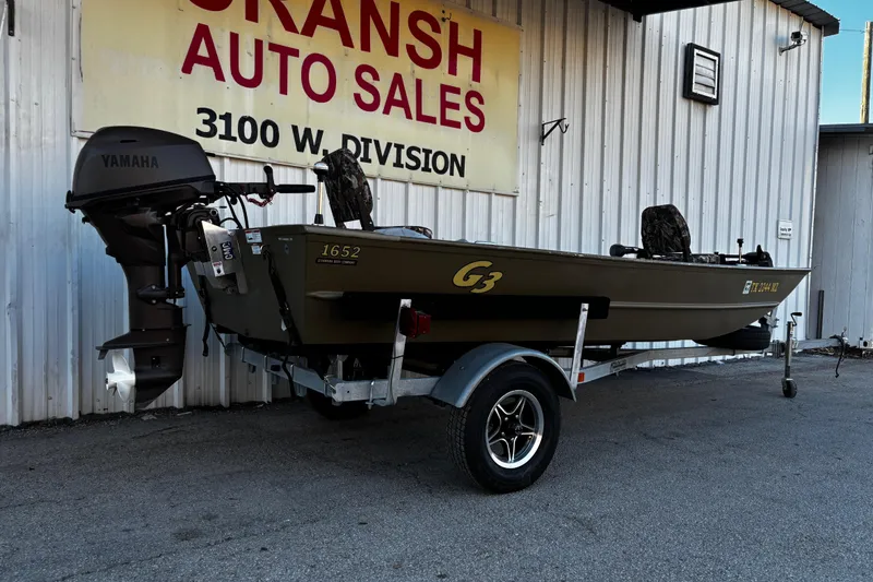 Slide: The Image of 2025 G3 Gator Tough 1652 VBW boat on trailer at dealership. - 23