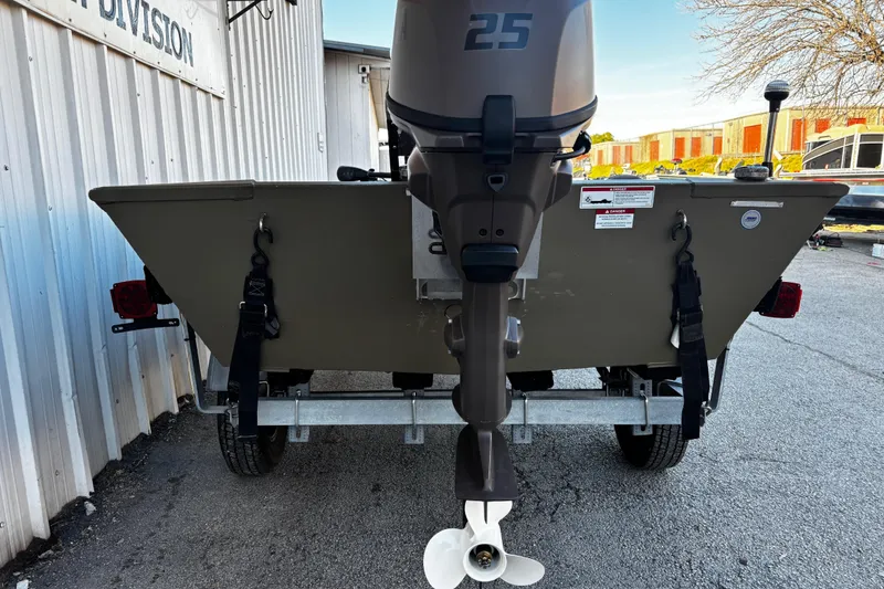 Slide: The Image of 2025 G3 Gator Tough 1652 VBW boat on trailer, rear view with outboard motor. - 28