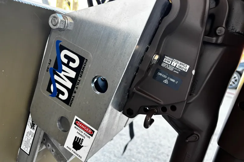 Slide: The Image of Close-up of 2025 G3 Gator Tough 1652 VBW boat motor mount with safety warning labels. - 31