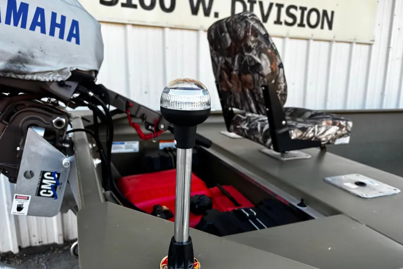 Slide: The Image of 2025 G3 Gator Tough 1652 VBW boat interior with Yamaha motor and camo seat. - 37