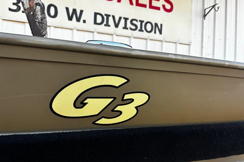 Slide: The Image of 2025 G3 Gator Tough 1652 VBW boat with logo, displayed near sales sign. - 38