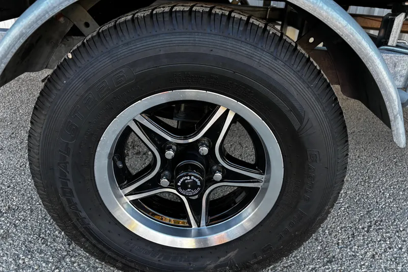 Slide: The Image of 2025 G3 Gator Tough 1652 VBW trailer wheel with black and silver rim design. - 39