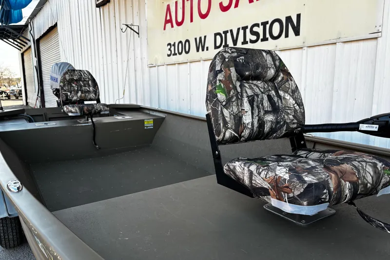Slide: The Image of 2025 G3 Gator Tough 1652 VBW boat with camouflage seats at auto sales location. - 45