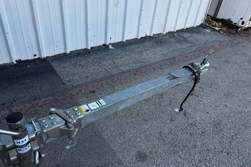 Slide: The Image of Trailer hitch of 2025 G3 Gator Tough 1652 VBW on asphalt near metal wall. - 48