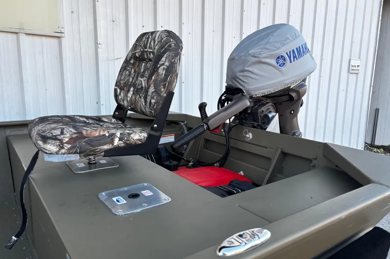 Slide: The Image of 2025 G3 Gator Tough 1652 VBW boat with camo seat and Yamaha motor cover. - 55