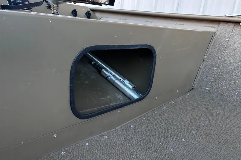 Slide: The Image of Storage compartment in 2025 G3 Gator Tough 1652 VBW boat interior. - 57