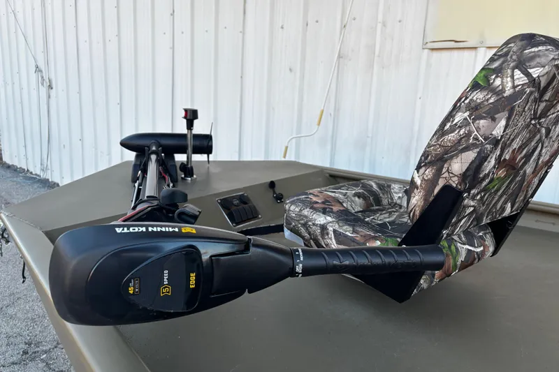 Slide: The Image of 2025 G3 Gator Tough 1652 VBW boat with camo seat and Minn Kota trolling motor. - 58