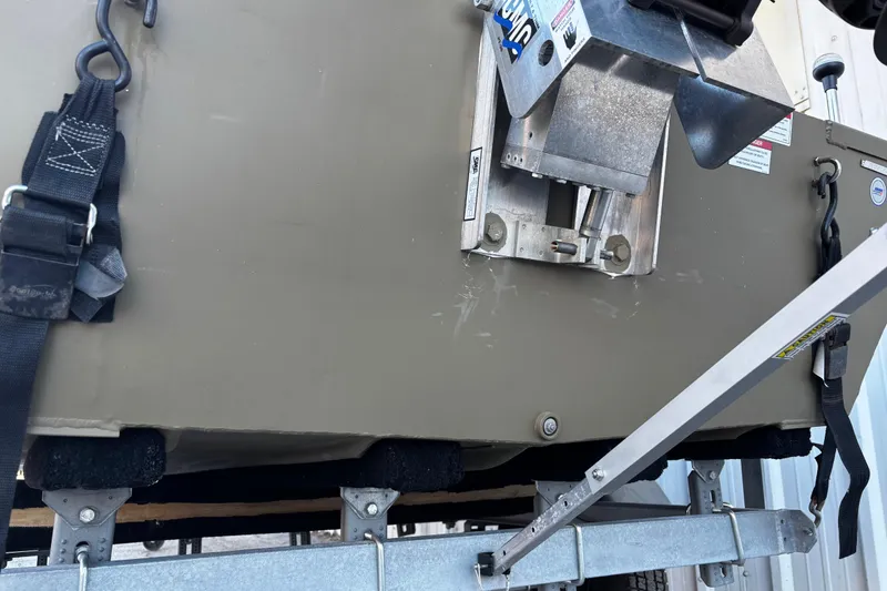 Slide: The Image of 2025 G3 Gator Tough 1652 VBW boat on trailer with securing straps. - 65