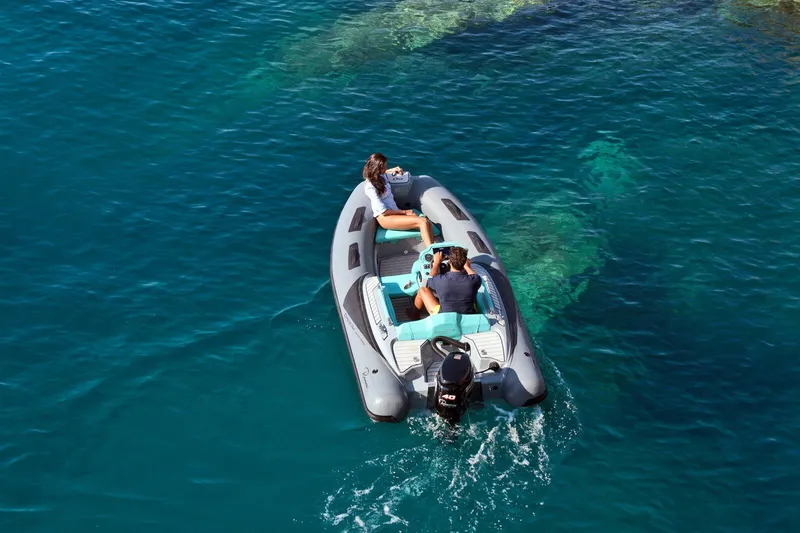 Slide: The Image of 2026 Ranieri CAYMAN ONE LUXURY TENDER cruising on clear blue water. - 2