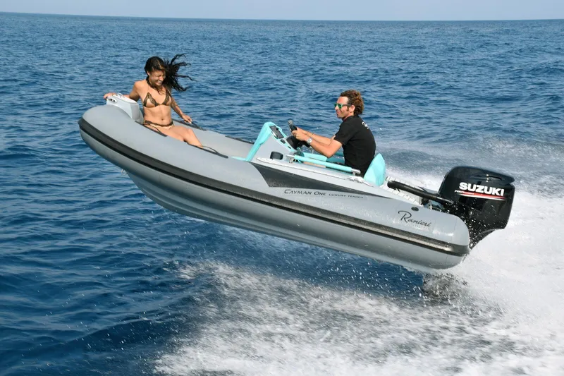 Slide: The Image of 2026 Ranieri CAYMAN ONE LUXURY TENDER speeding on ocean with two passengers. - 4