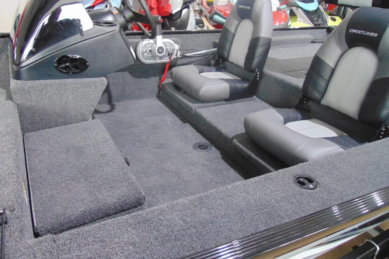 Slide: The Image of 2026 Crestliner 1700 Storm boat interior with dual seats and steering console. - 4