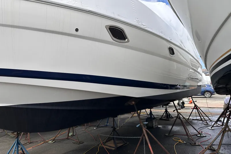 Slide: The Image of 2016 Regal 35 Sport Coupe yacht on stands, undergoing maintenance. - 18